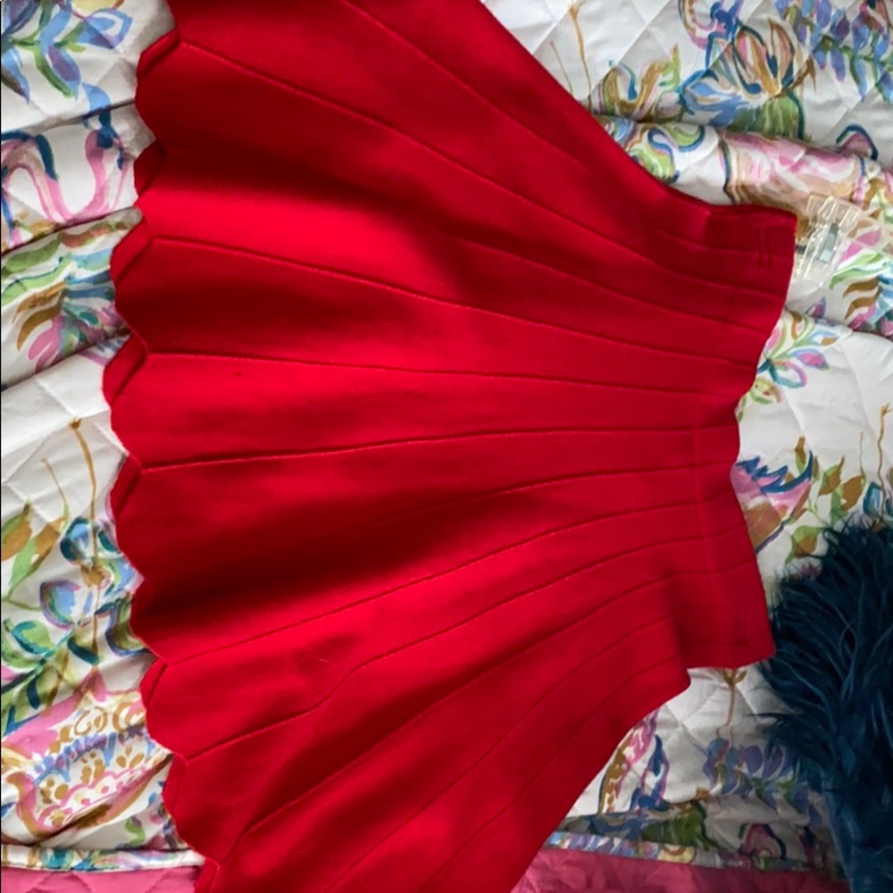 Red sweater like material skirt with scalloped end